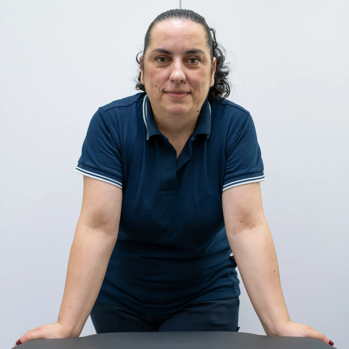 Retrato da profissional no espaço de atendimento